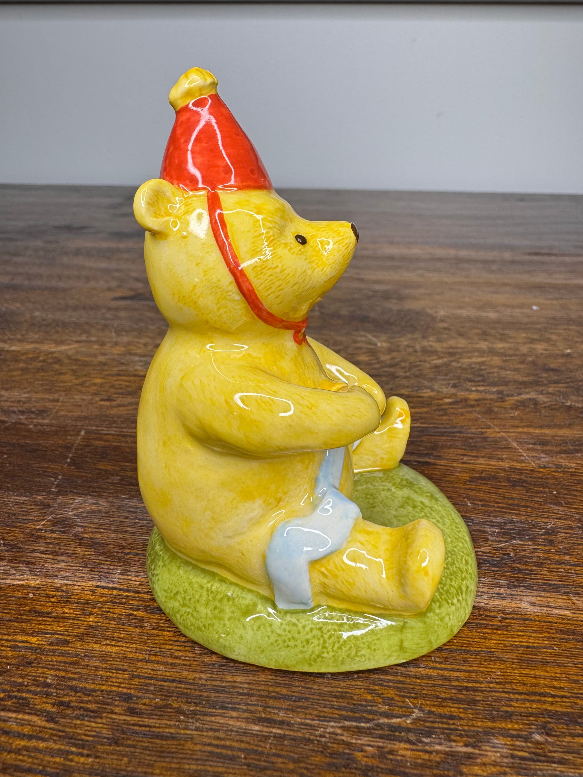 Royal Doulton Winnie the Pooh in A Party Hat Figurine