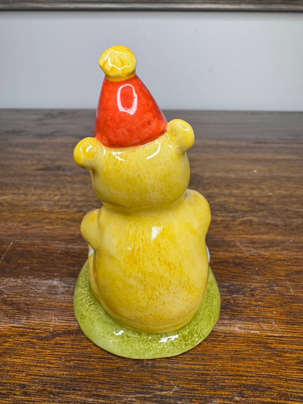 Royal Doulton Winnie the Pooh in A Party Hat Figurine