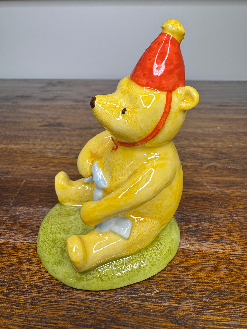 Royal Doulton Winnie the Pooh in A Party Hat Figurine