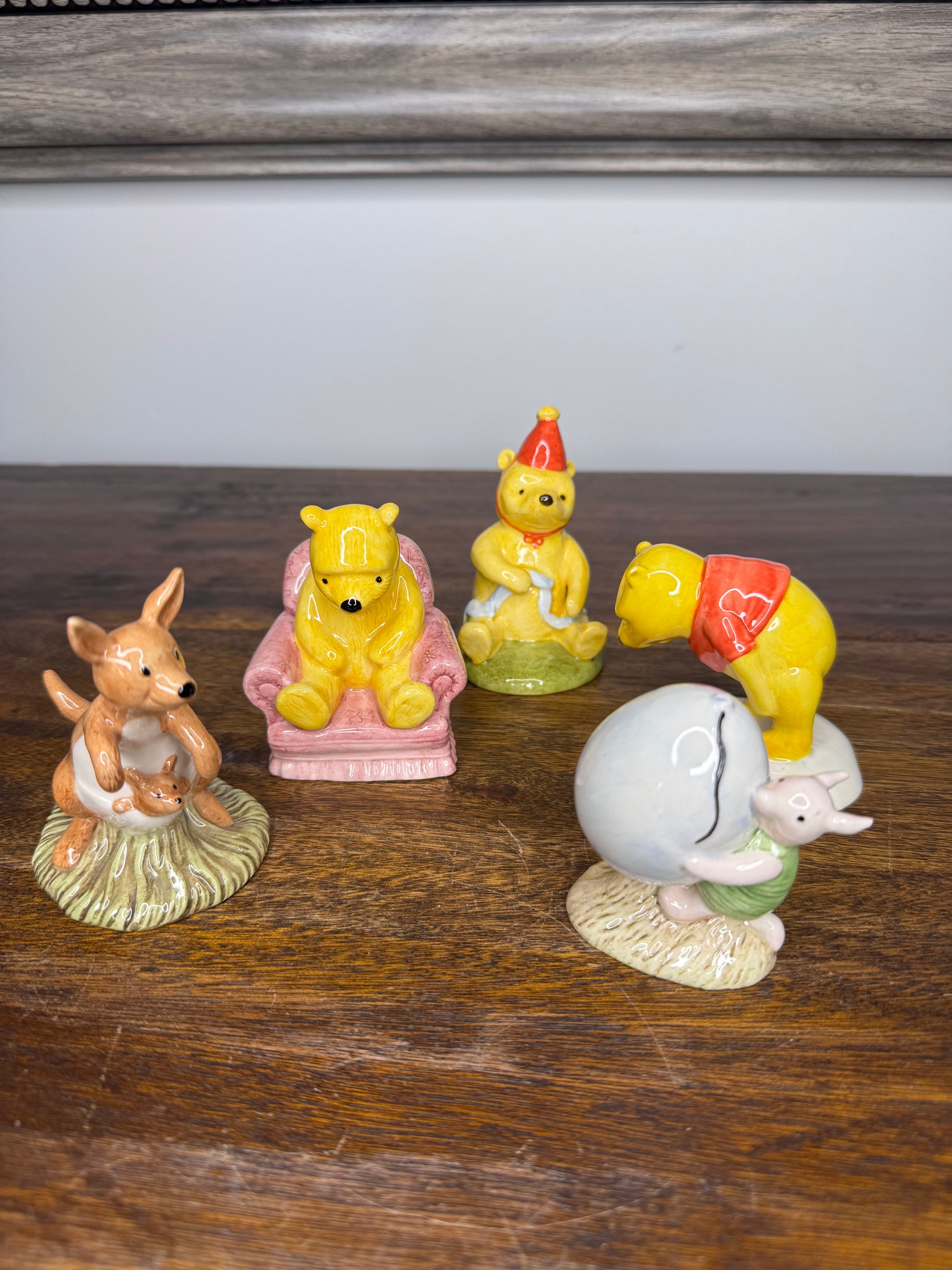 Royal Doulton Winnie the Pooh in A Party Hat Figurine