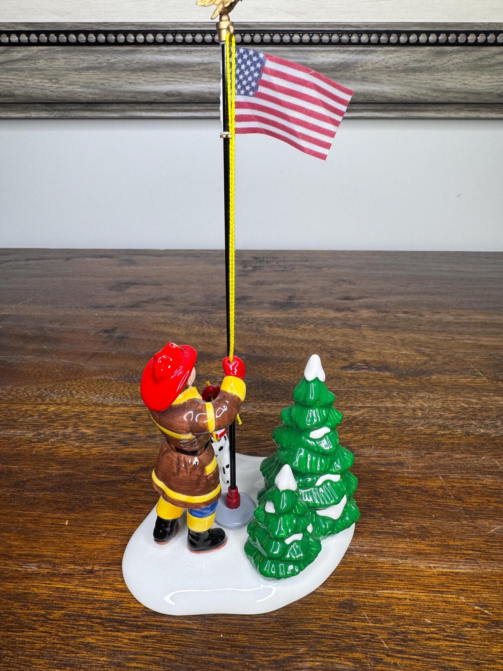 Retired Dept 56 Snow Village Raising the Flag Firefighter Figurine w/ Original Box
